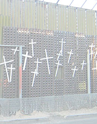 Photo of Mexico - U.S. border fence decorated with crosses