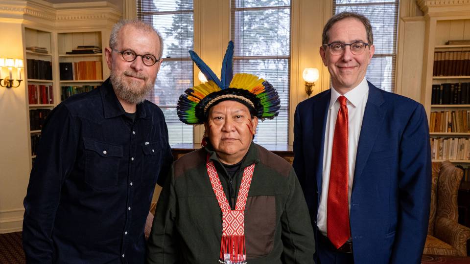 Amazonian Indigenous leader Davi Kopenawa (center) and a group of Yanomami visitors were welcomed by President Christopher L. Eisgruber (right) and others in a reception at Prospect House prior to the public event. Professor of Anthropology João Biehl is shown at left. Photo by David Dooley/Fotobuddy