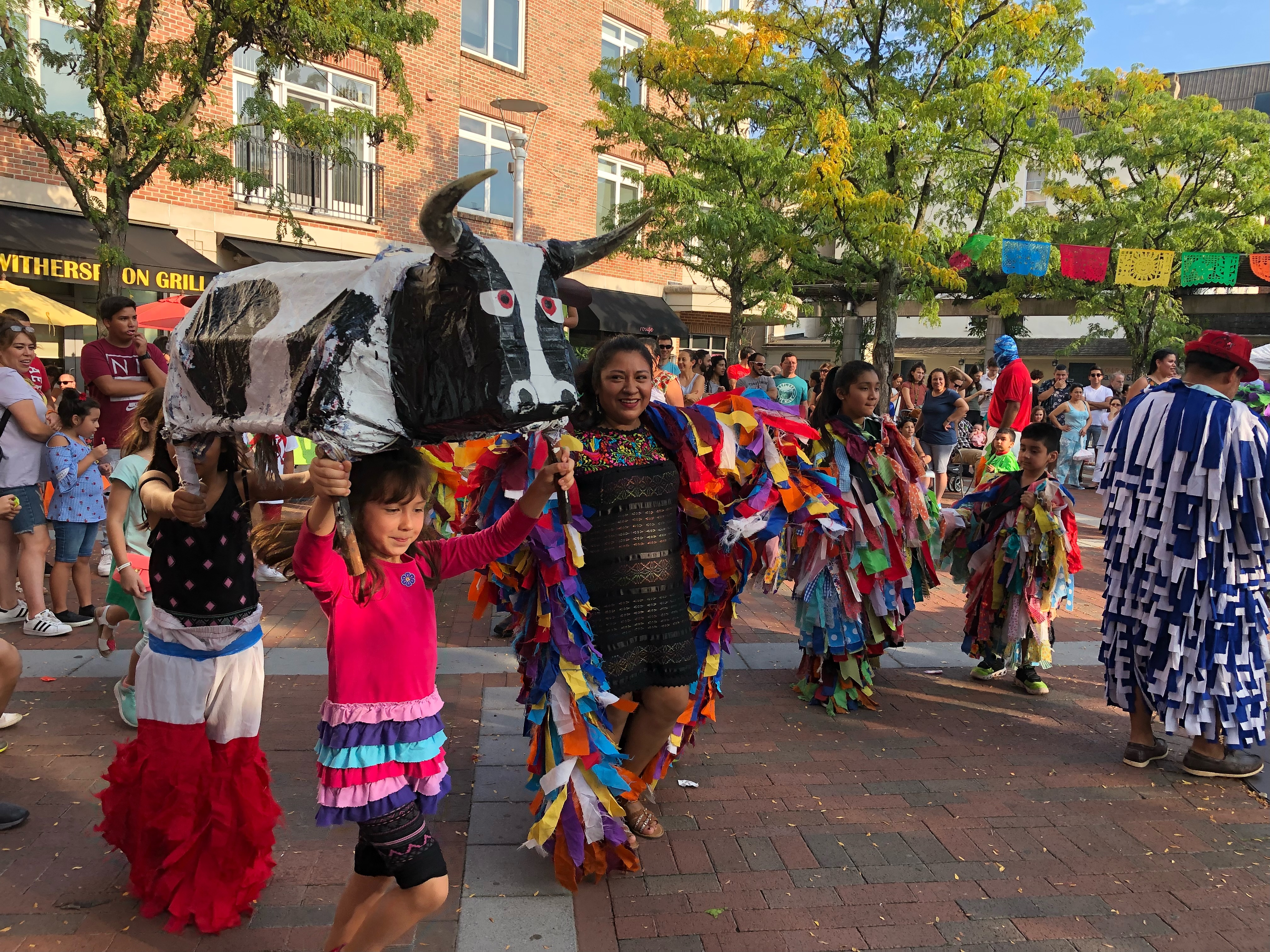 A crowd of people in colorful costumes