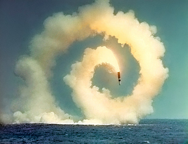 Close Encounters: Facing the Bomb in a New Nuclear Age exhibit, photo of missile in spiral heading toward the ocean waters