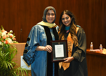 Nausheen Rajan receiving award from Dean Jamal