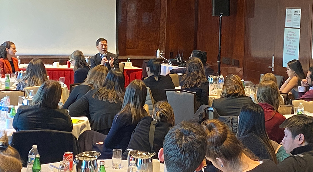 Chris Lu speaking with SPIA students during UN tour