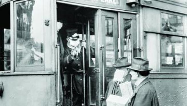 During the Spanish Flu pandemic of 1918-19, face masks were required on public transit in Seattle, Washington. Ian Dagnall Computing/Alamy