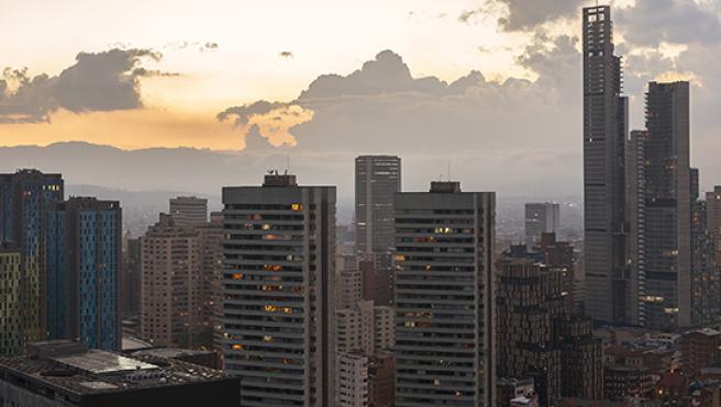 The skyline of modern buildings in Bogota, Columbia during sunset.