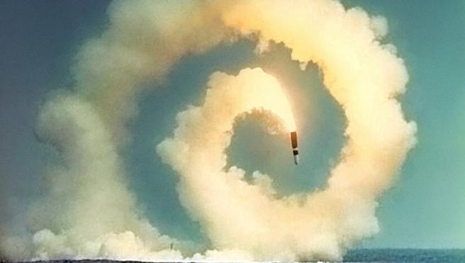 Close Encounters: Facing the Bomb in a New Nuclear Age exhibit, photo of missile in a spiral heading toward ocean water