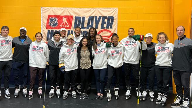 Melissa Parnagian (front, center) with NHL Player Inclusion Coalition. Photo Credit: Melissa Parnagian