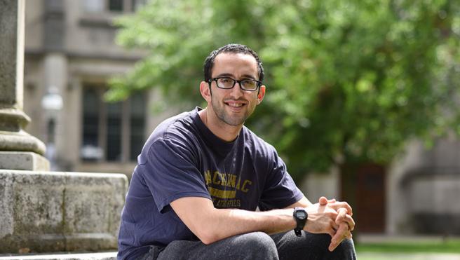 Jeff Simon sitting on a stone step in Princeton campus
