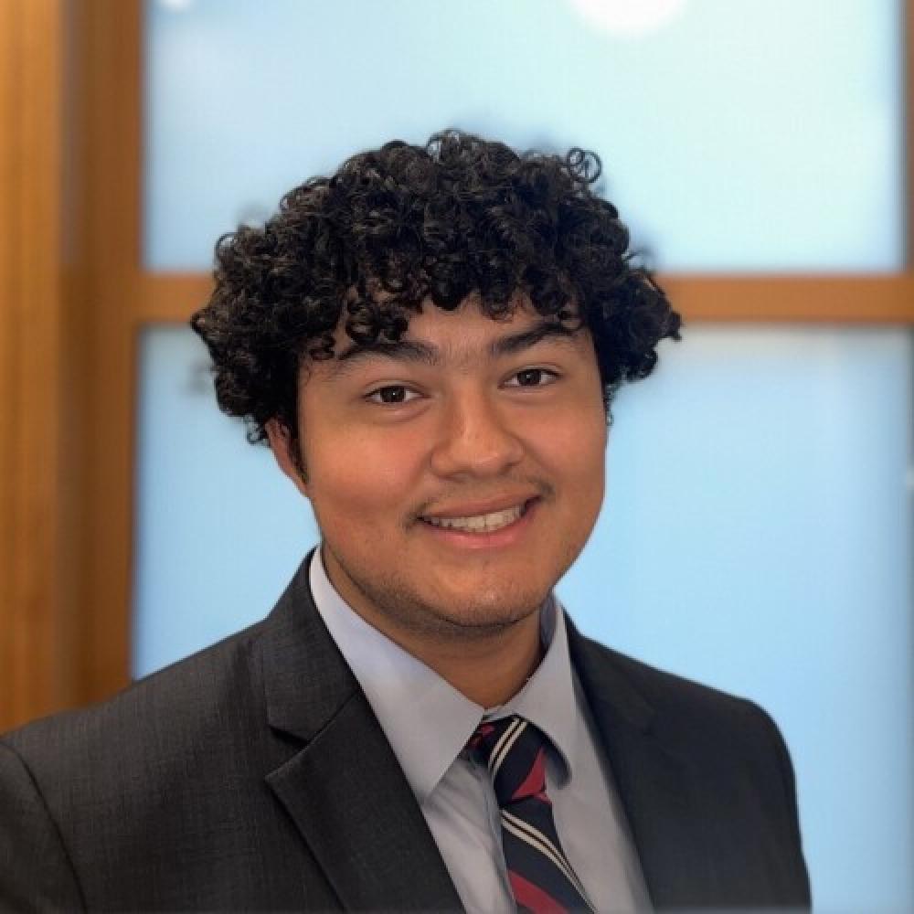 headshot of C. Robles, fellow