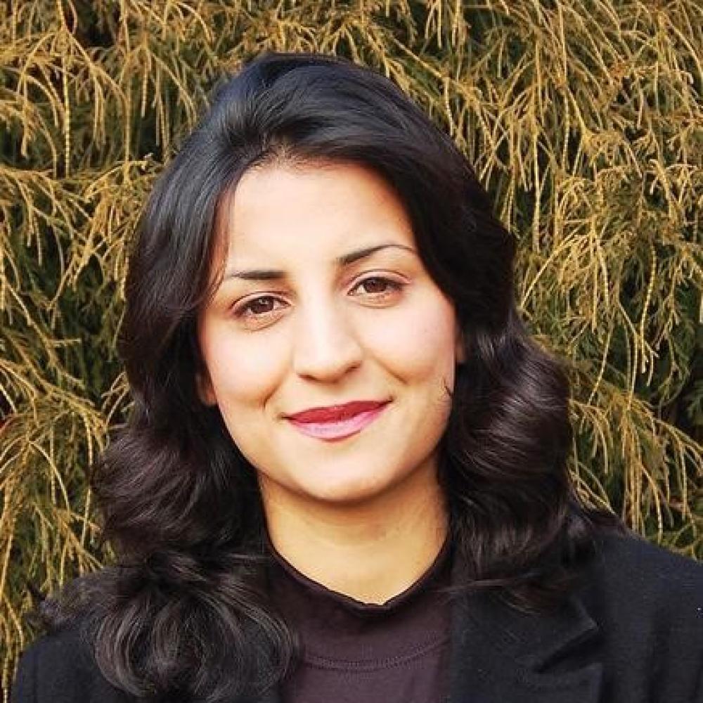 women with brown hair and field background