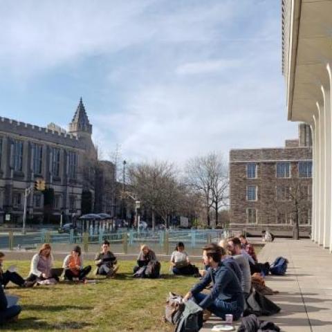 SPIA students sitting socially distanced outside Robertson