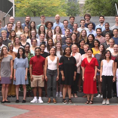 group of students standing on steps