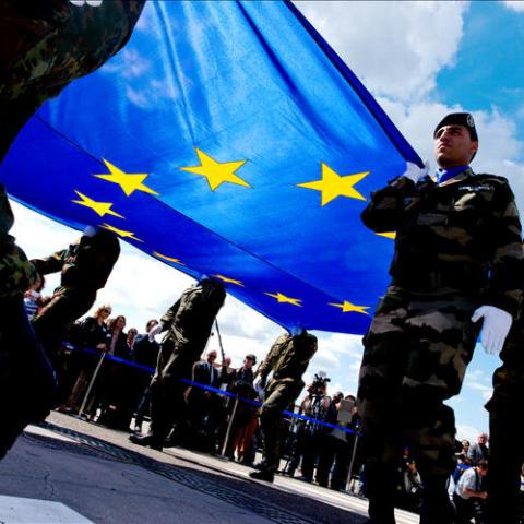 soldiers holding EU flag