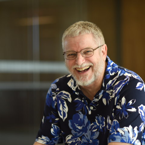 Man in a shirt with blue flowers