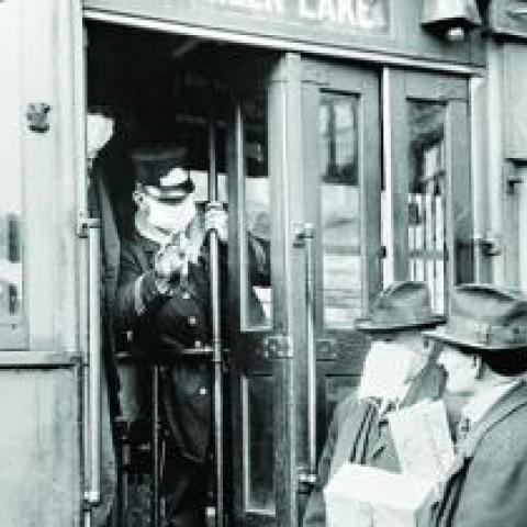 During the Spanish Flu pandemic of 1918-19, face masks were required on public transit in Seattle, Washington. Ian Dagnall Computing/Alamy