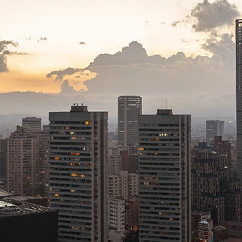 The skyline of modern buildings in Bogota, Columbia during sunset.