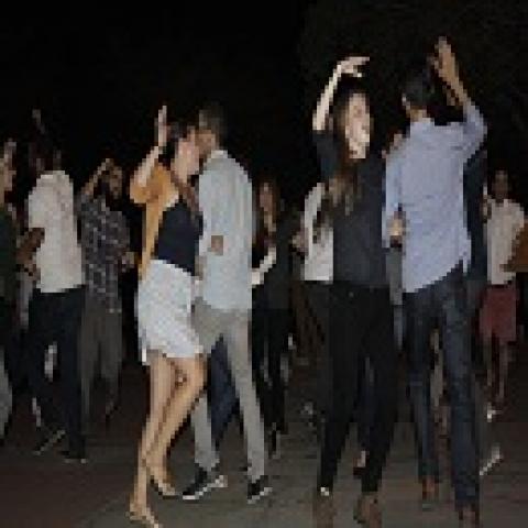 Couples Hooking arms in square dance