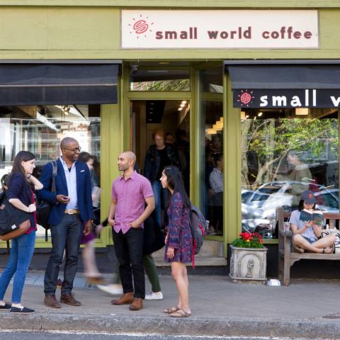 Students standing in front of coffee shop.