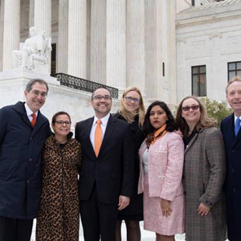 (From left) Princeton President Christopher L. Eisgruber; Princeton Vice President and General Counsel Ramona Romero; Princeton Associate University Counsel Wes Markham; Microsoft Assistant General Counsel Cindy Randall; Princeton Class of 2018 graduate Maria Perales Sanchez; Lindsay Harrison, litigator and partner at Jenner & Block; and Microsoft President and Princeton University Trustee Brad Smith stand in front of the steps of the U.S. Supreme Court in November 2019.
