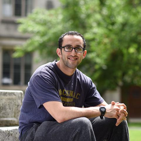Jeff Simon sitting on a stone step in Princeton campus