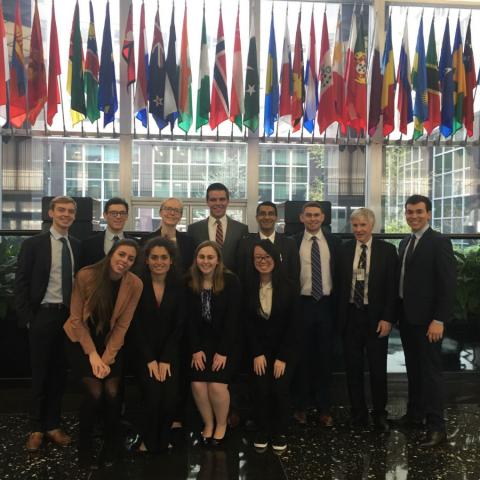 Students in front of flags