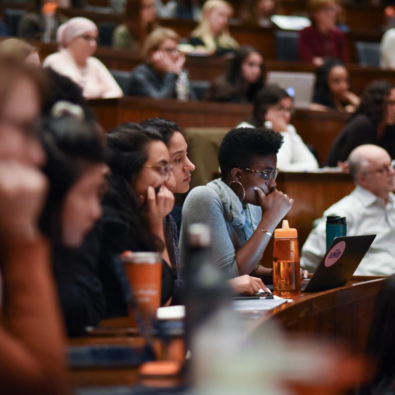 Group of people in a lecture hall.