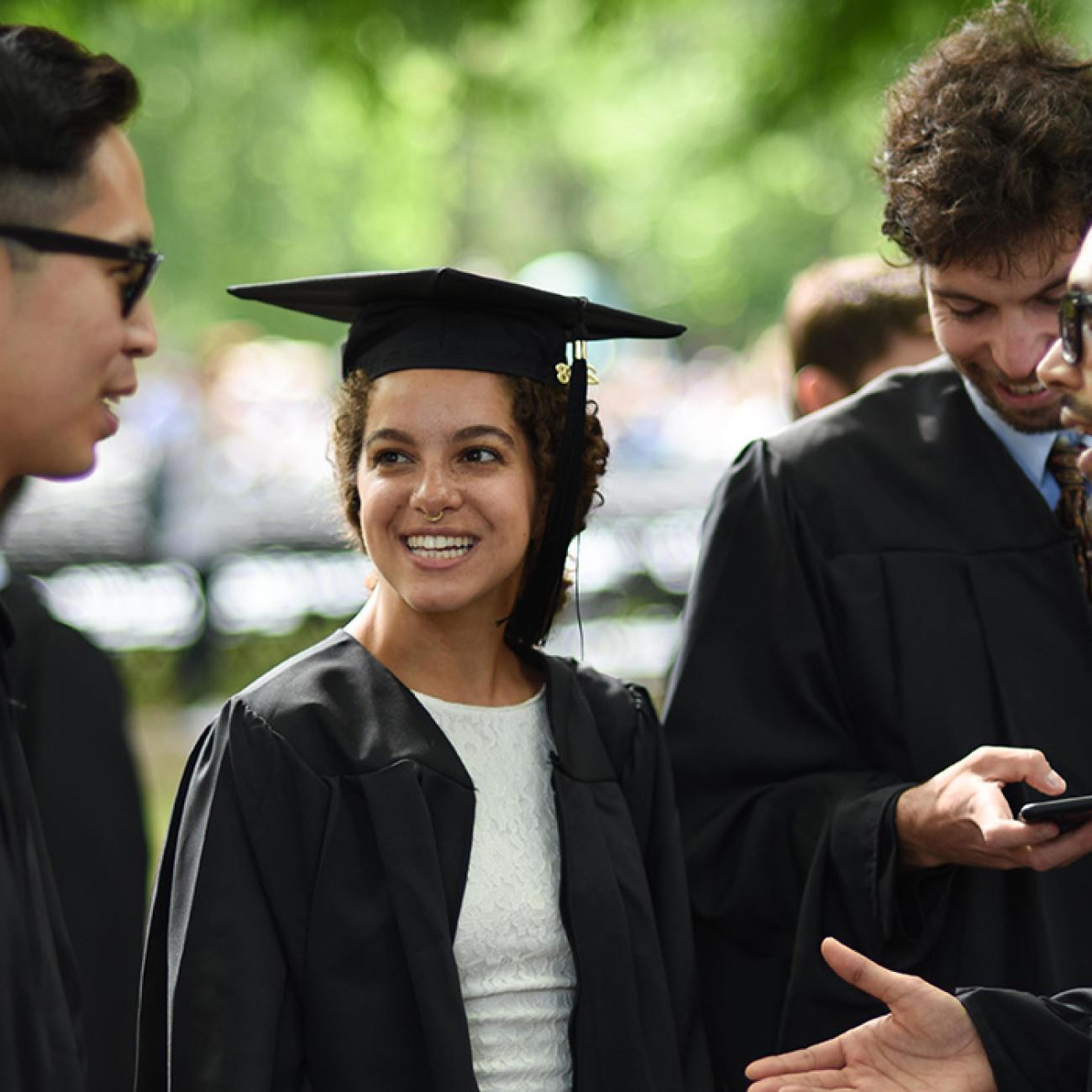 graduating students in conversation