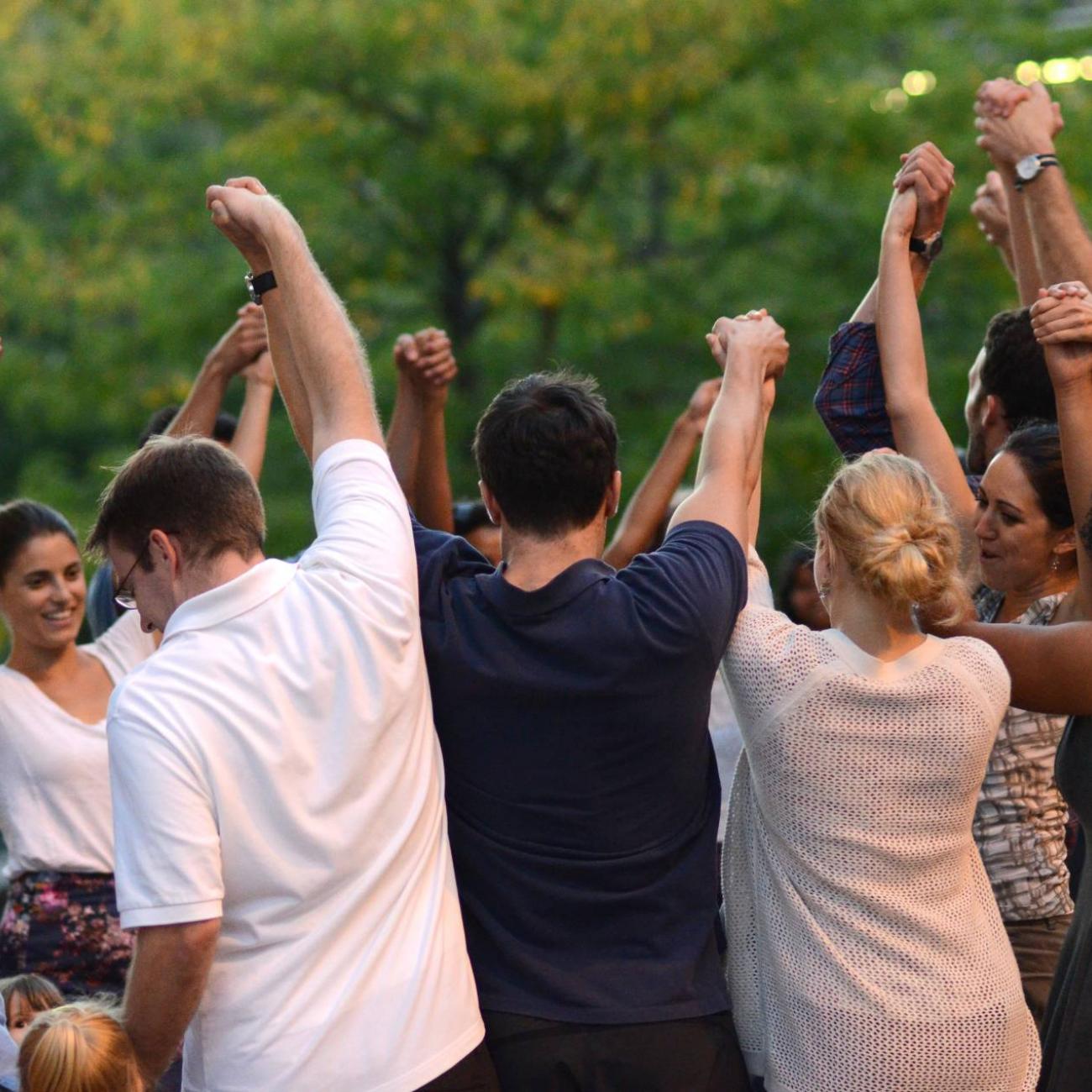 group of students holding hands