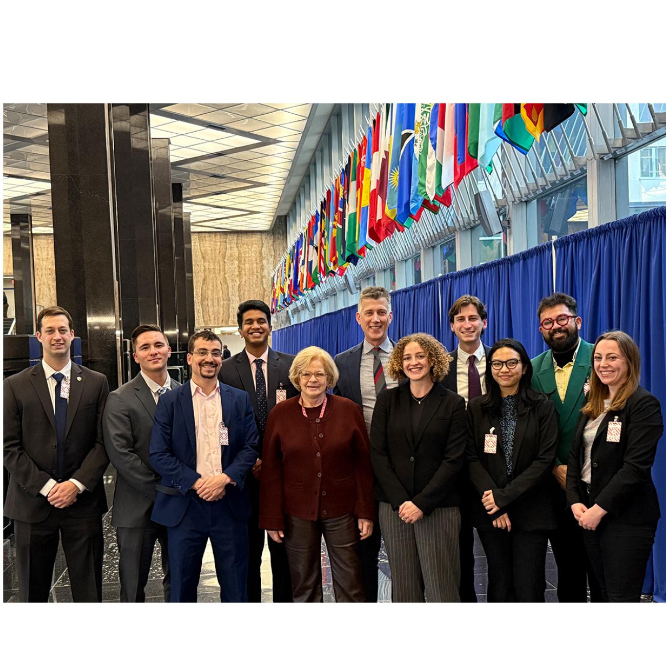 SPIA policy workshop students posing in front of flags