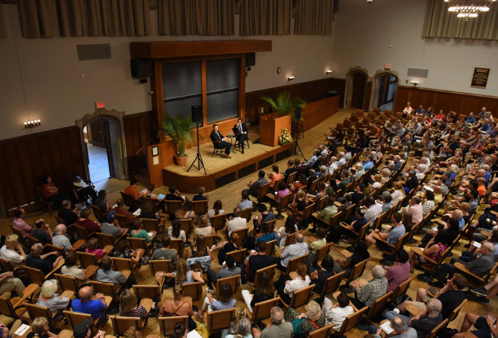 crowd of people attending an event in auditorium