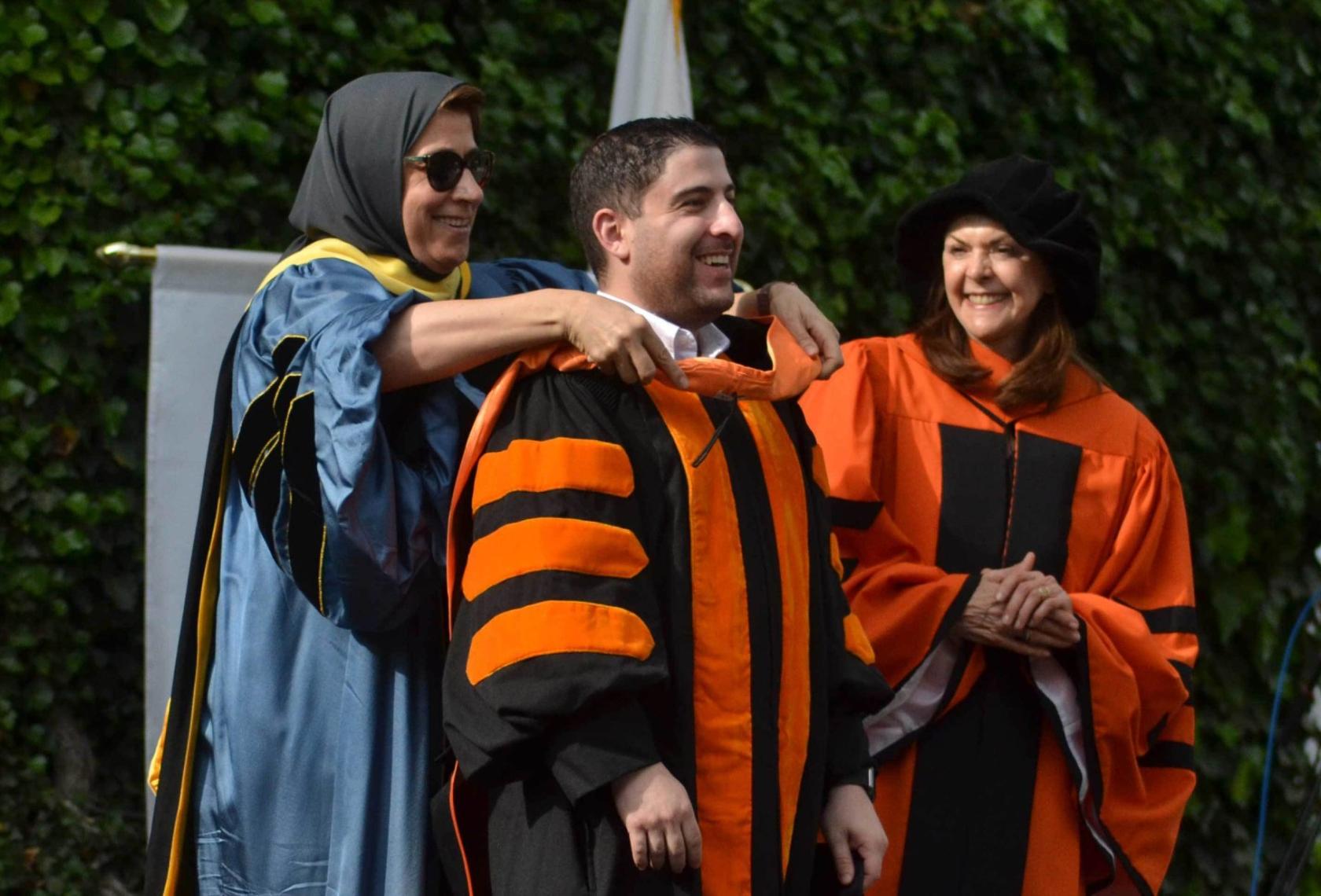 Dean Hooding Graduate