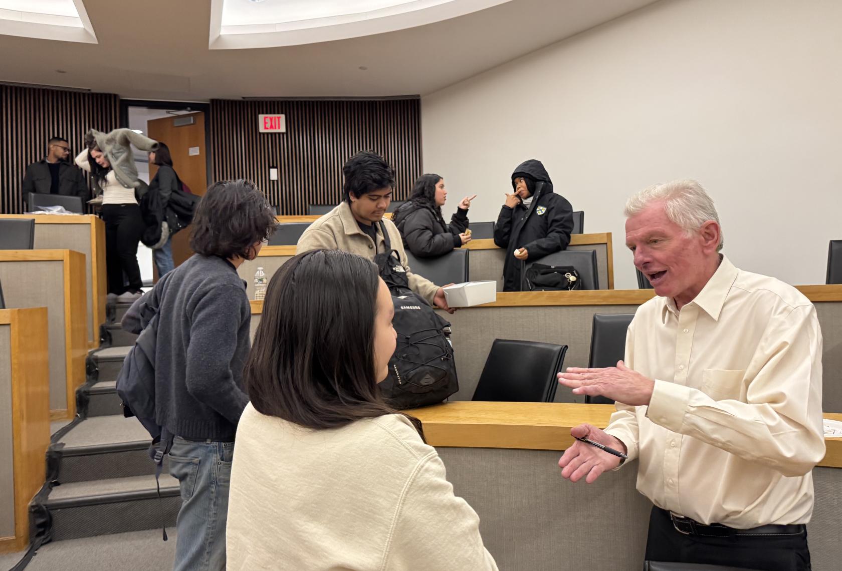 SPIA in New Jersey Faculty Fellow Joe Krakora (right) speaks with a student volunteer with the Clemency Project. Photo credit: Anastasia Mann