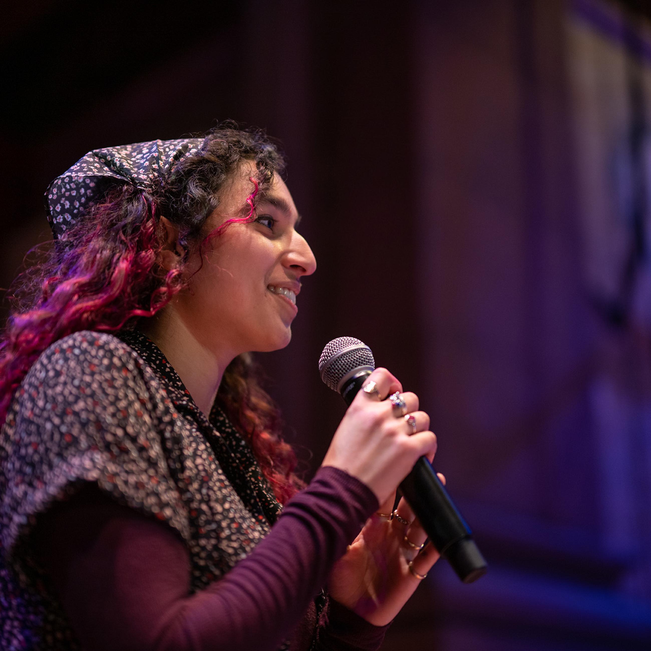 Event attendee with microphone during Q&A