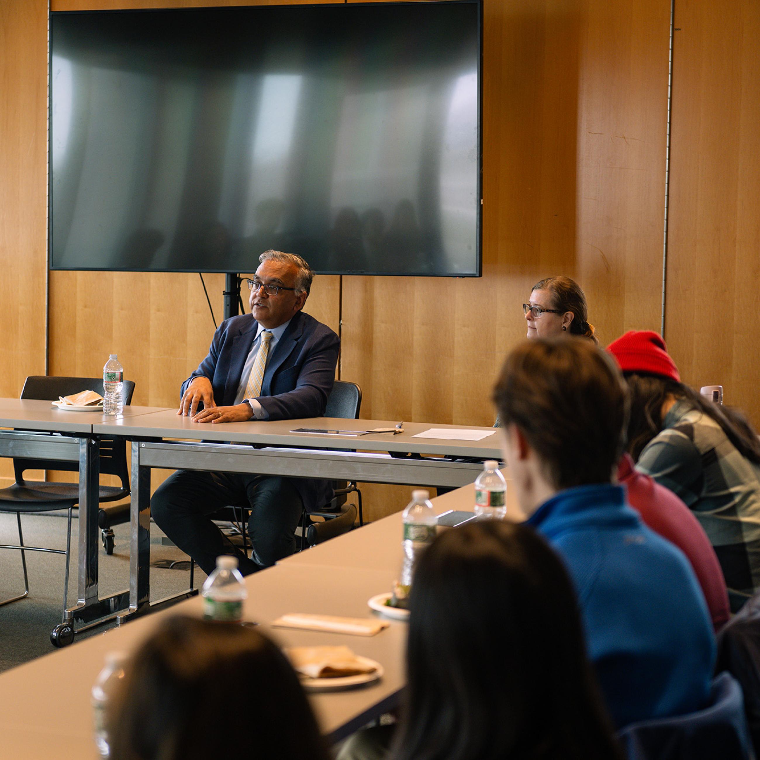 Ashish Jha and Janet Currie speaking with students