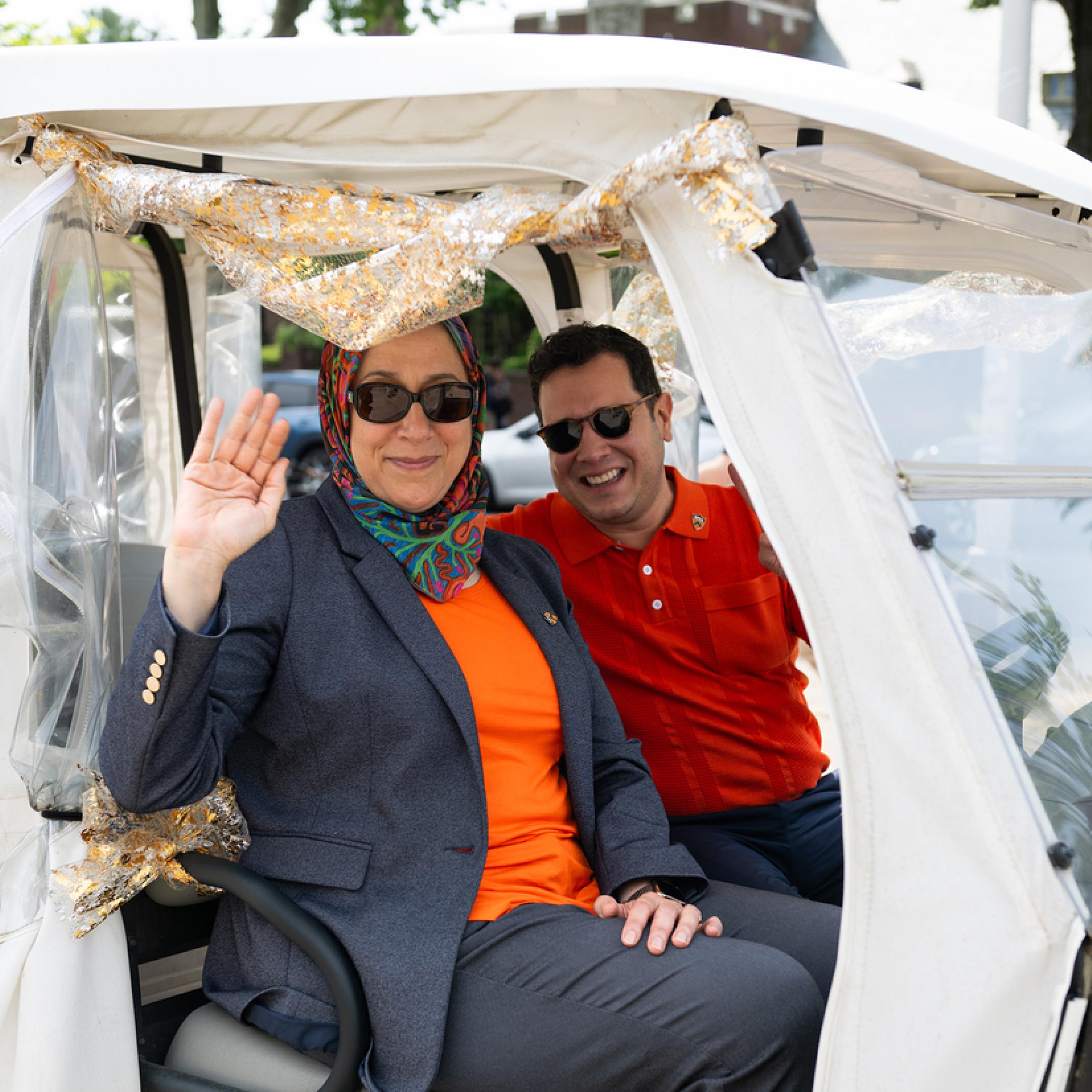 Dean Amaney Jamal and David Mayorga in golf cart