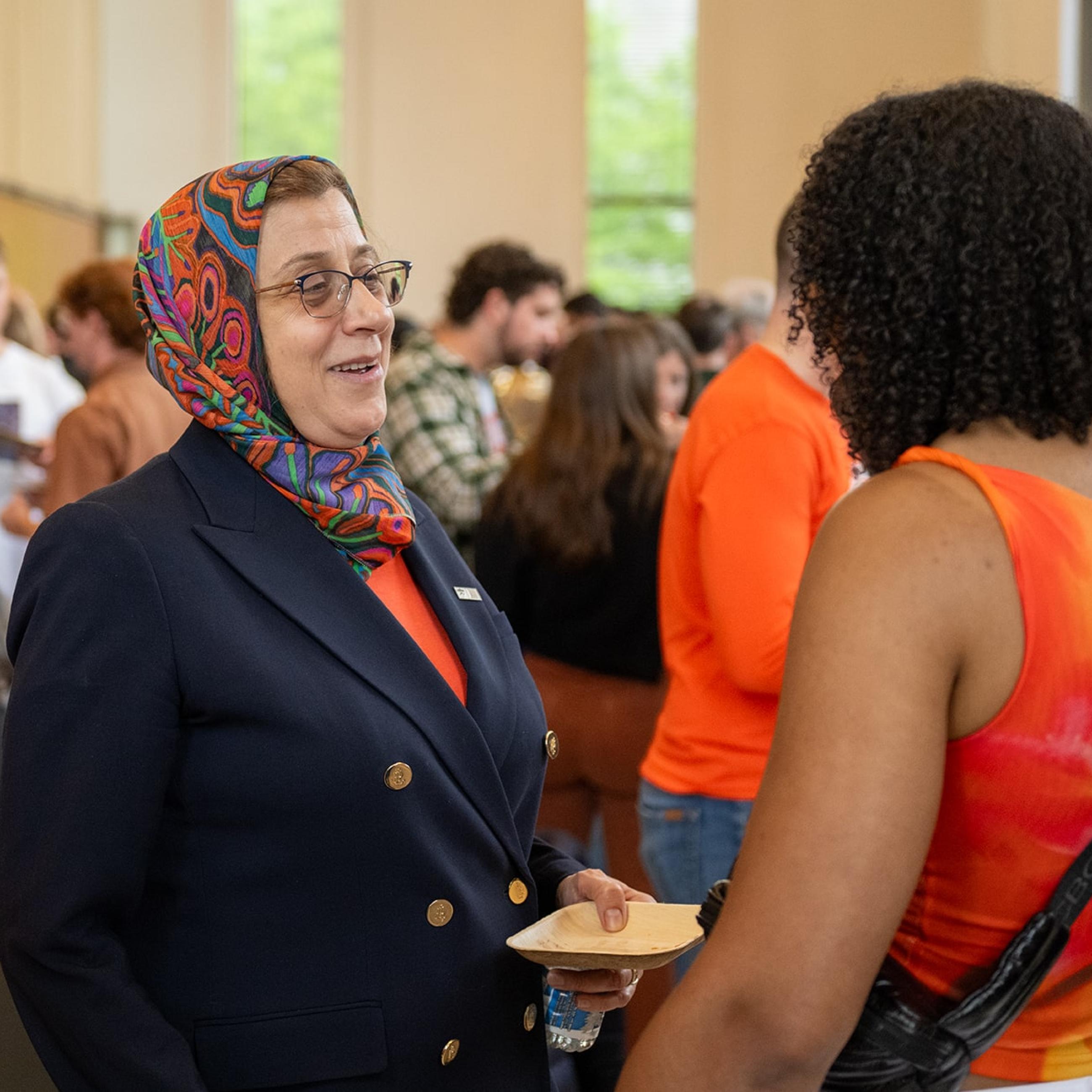 Dean Amaney Jamal speaking with alum during 2025 Reunions