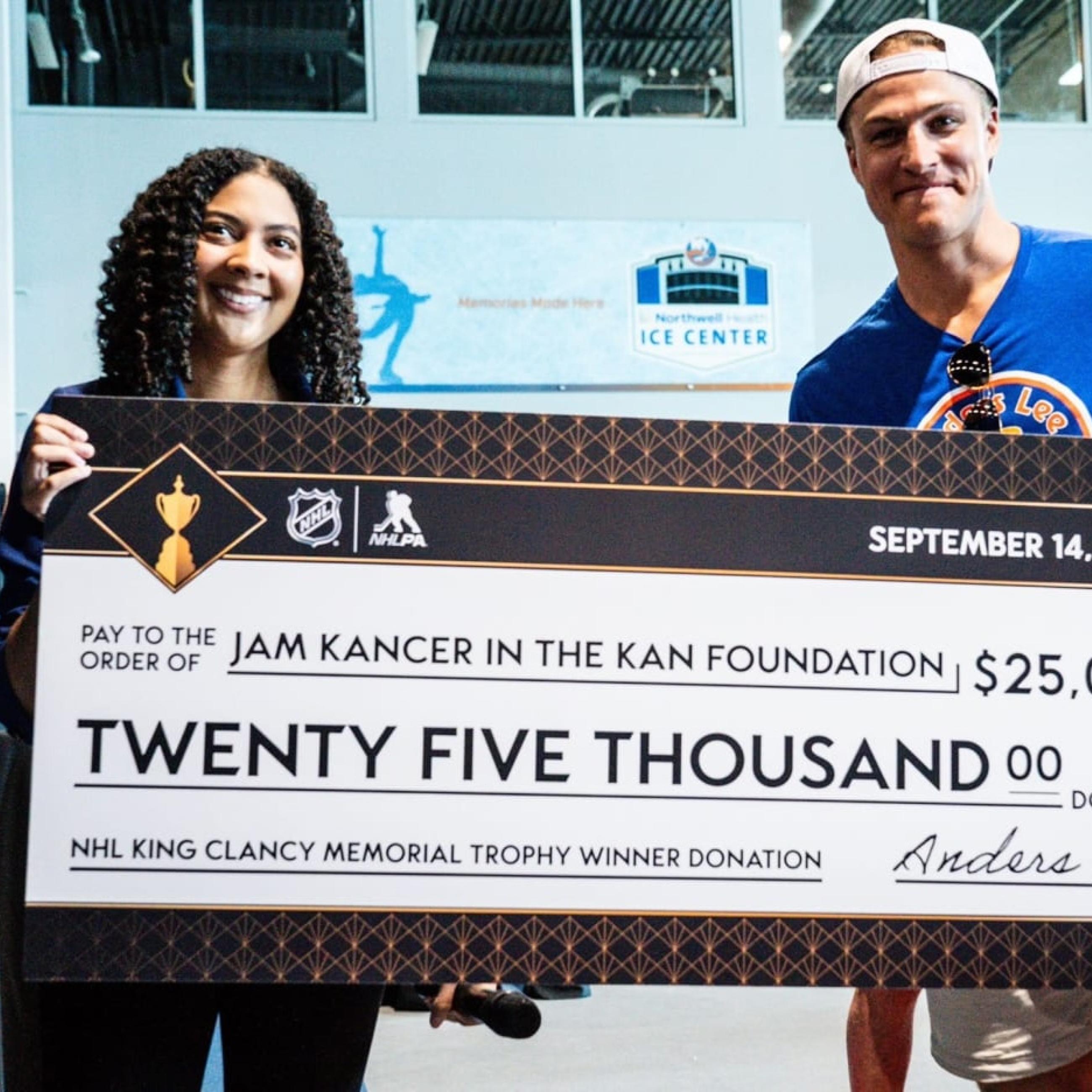 Melissa Parnagian with King Clancy Memorial Trophy Winner Anders Lee. Image Credit: Jam Kancer in the Kan Foundation
