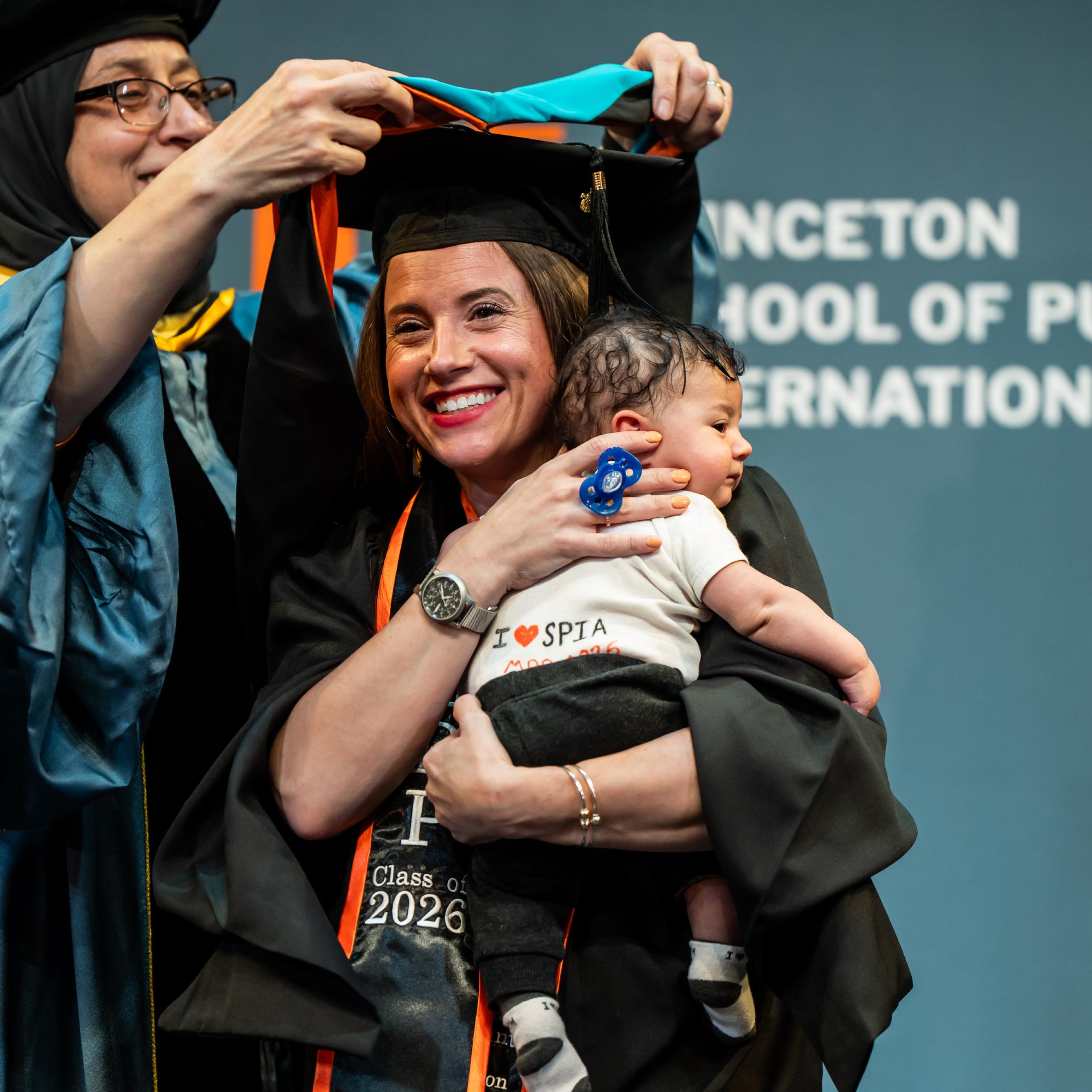 students at hooding ceremony