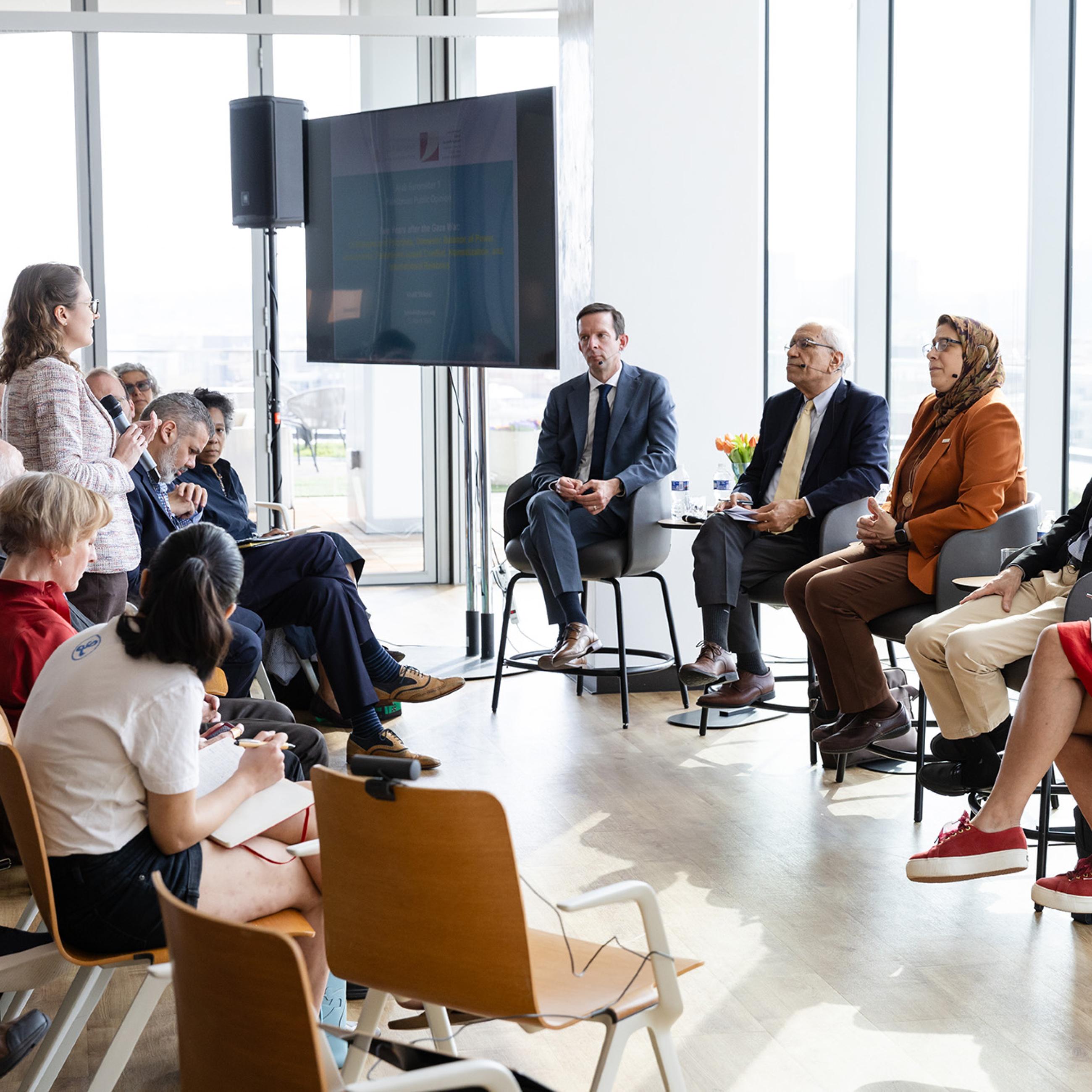 Panelists speaking with attendees at Public Opinion in the Middle East & North Africa event