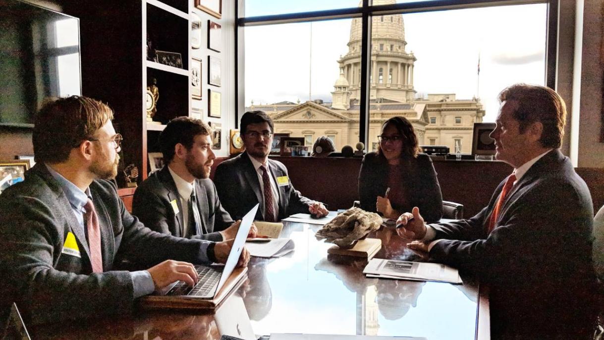 students gathered at a table