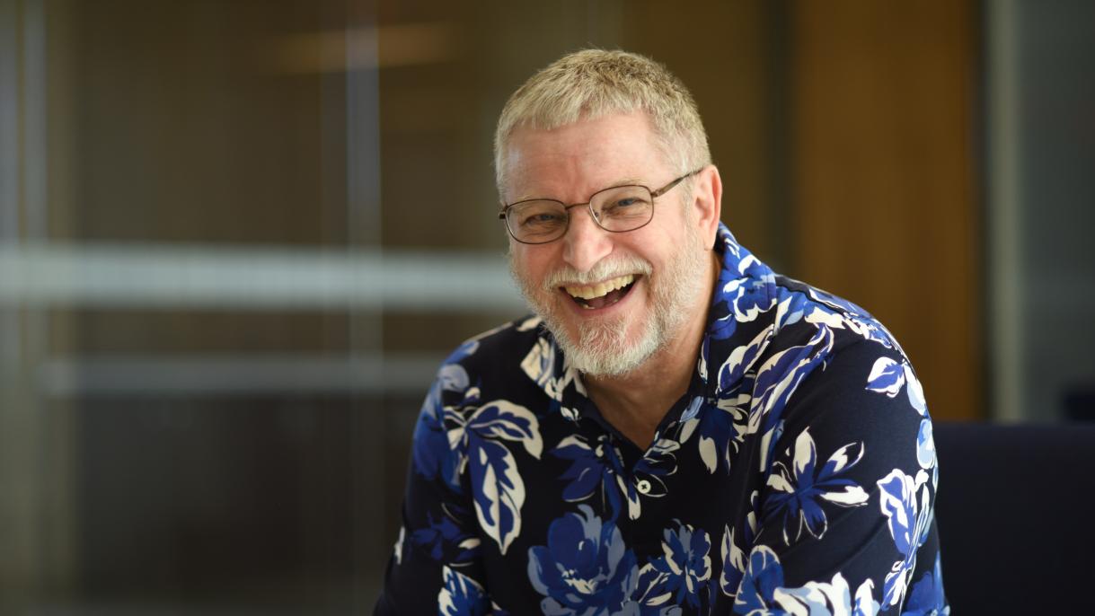 Man in a shirt with blue flowers