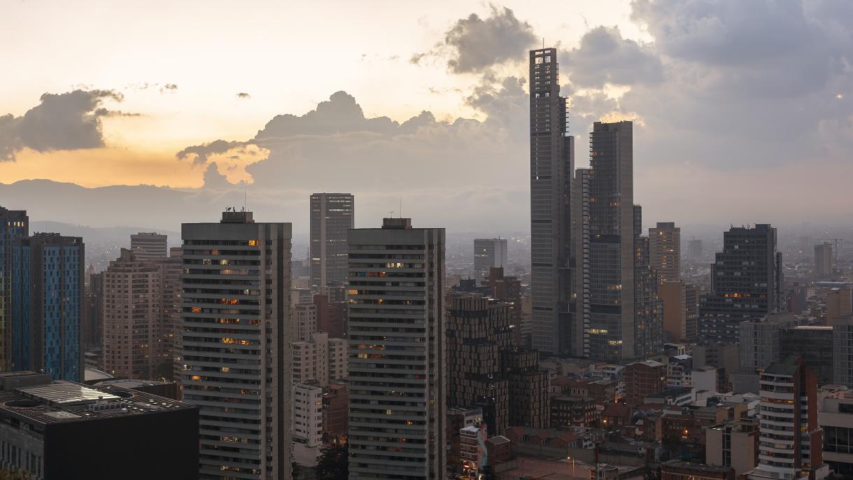 The skyline of modern buildings in Bogota, Columbia during sunset.