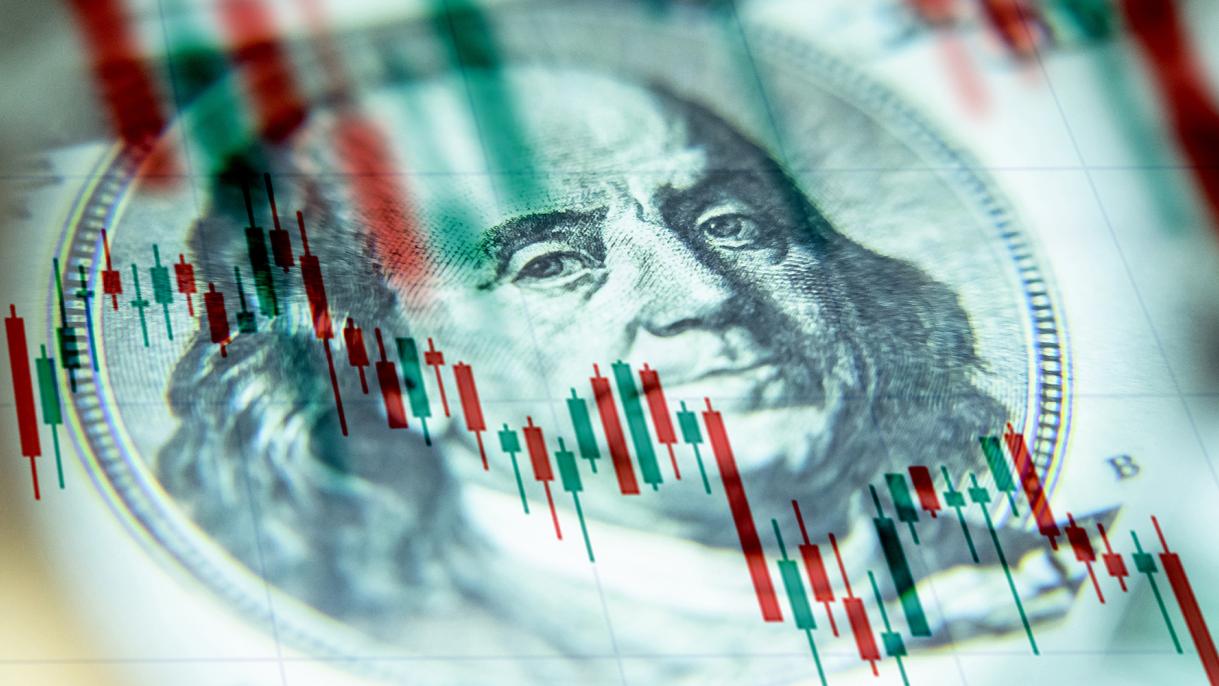 The us dollar against the background of a declining chart.