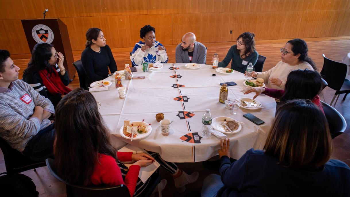 groups of students sitting at a table