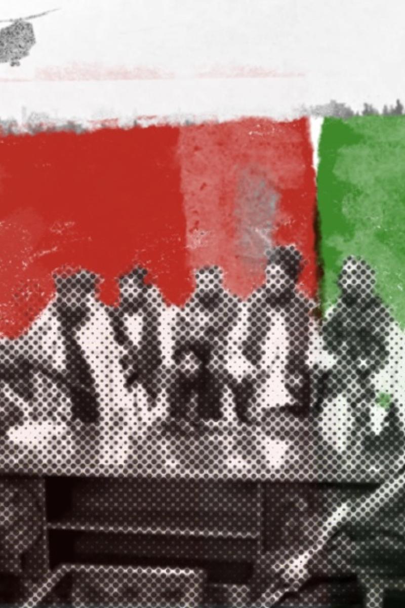 Taliban members gathered around a desk